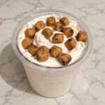 Cookie Dough Ninja Creami topped with FUUL protein cookie dough bites