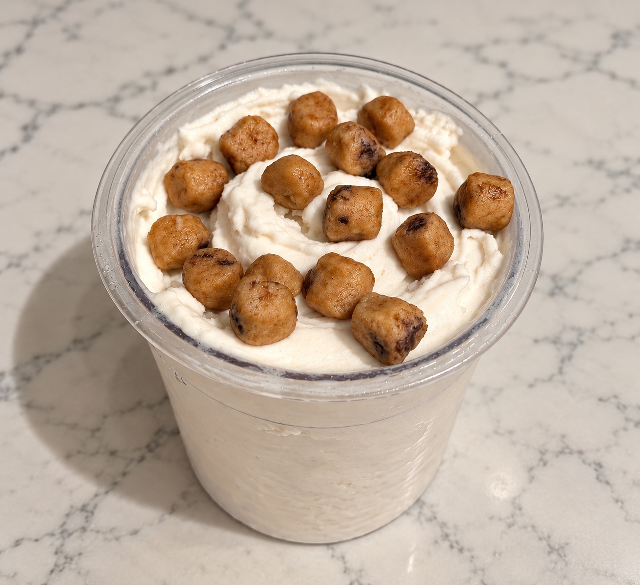 High-Protein Cookie Dough Ninja Creami topped with protein cookie dough