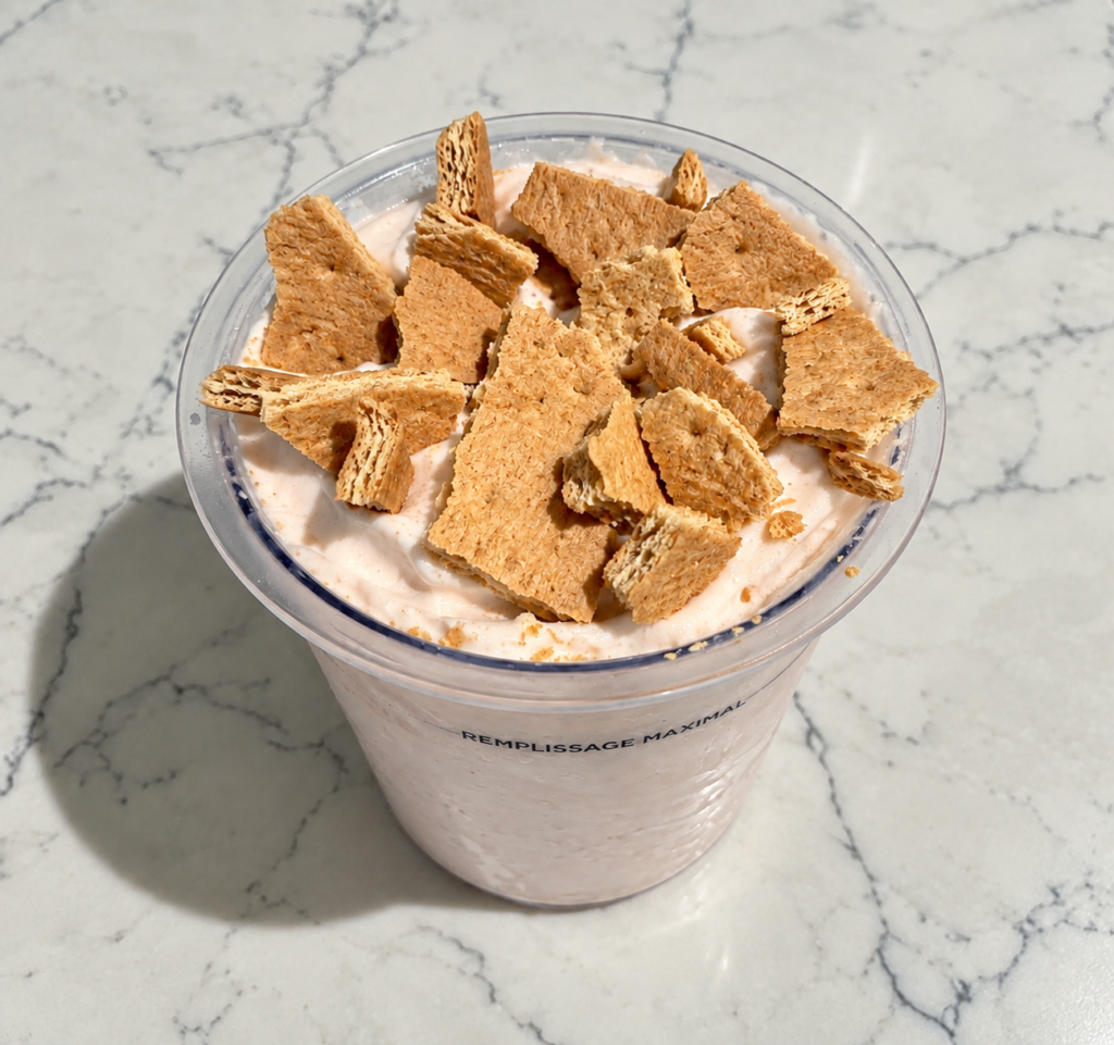 High-Protein Strawberry Cheesecake Ninja Creami topped with crumbled honey graham crackers