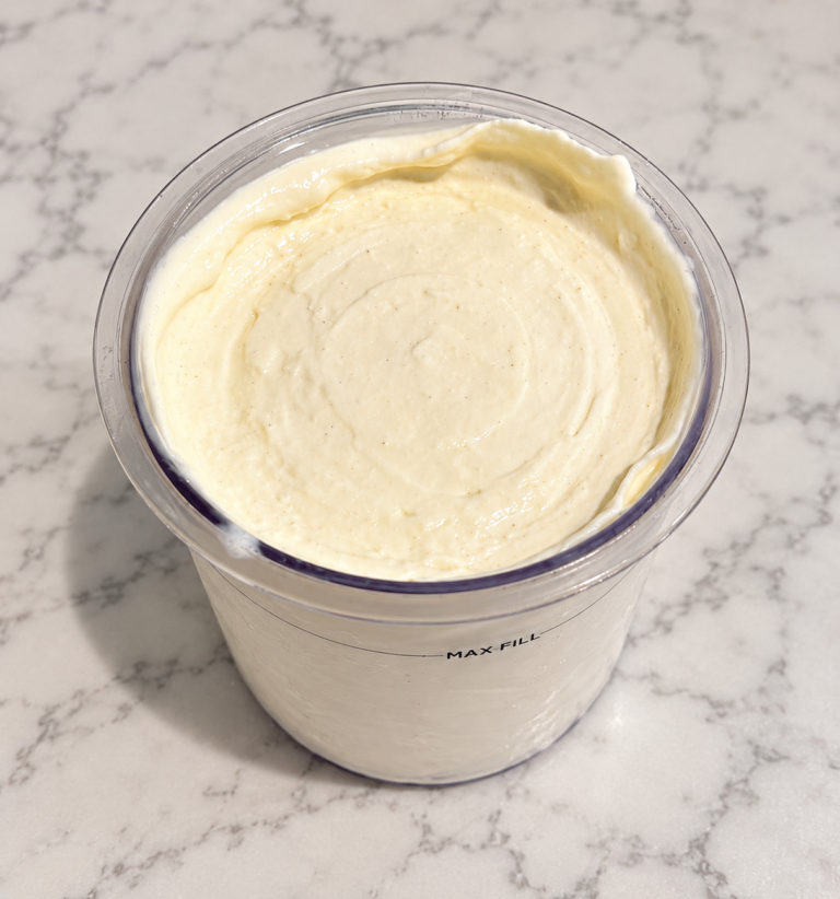 High-Protein Vanilla Pudding Ninja Creami with a smooth, creamy vanilla texture in a Ninja Creami pint
