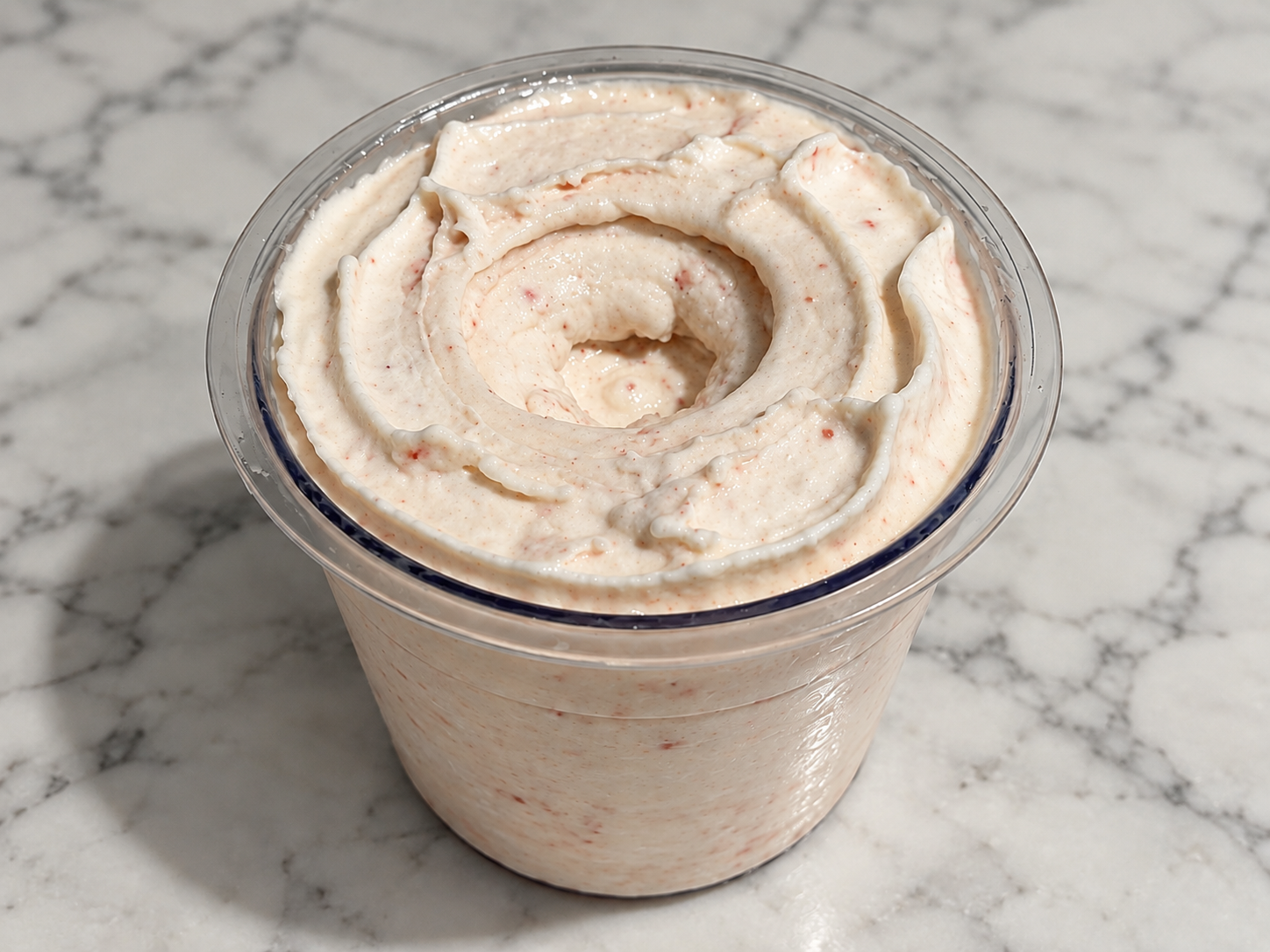 Strawberry Cheesecake Ninja Creami made without protein powder in a Ninja Creami pint.
