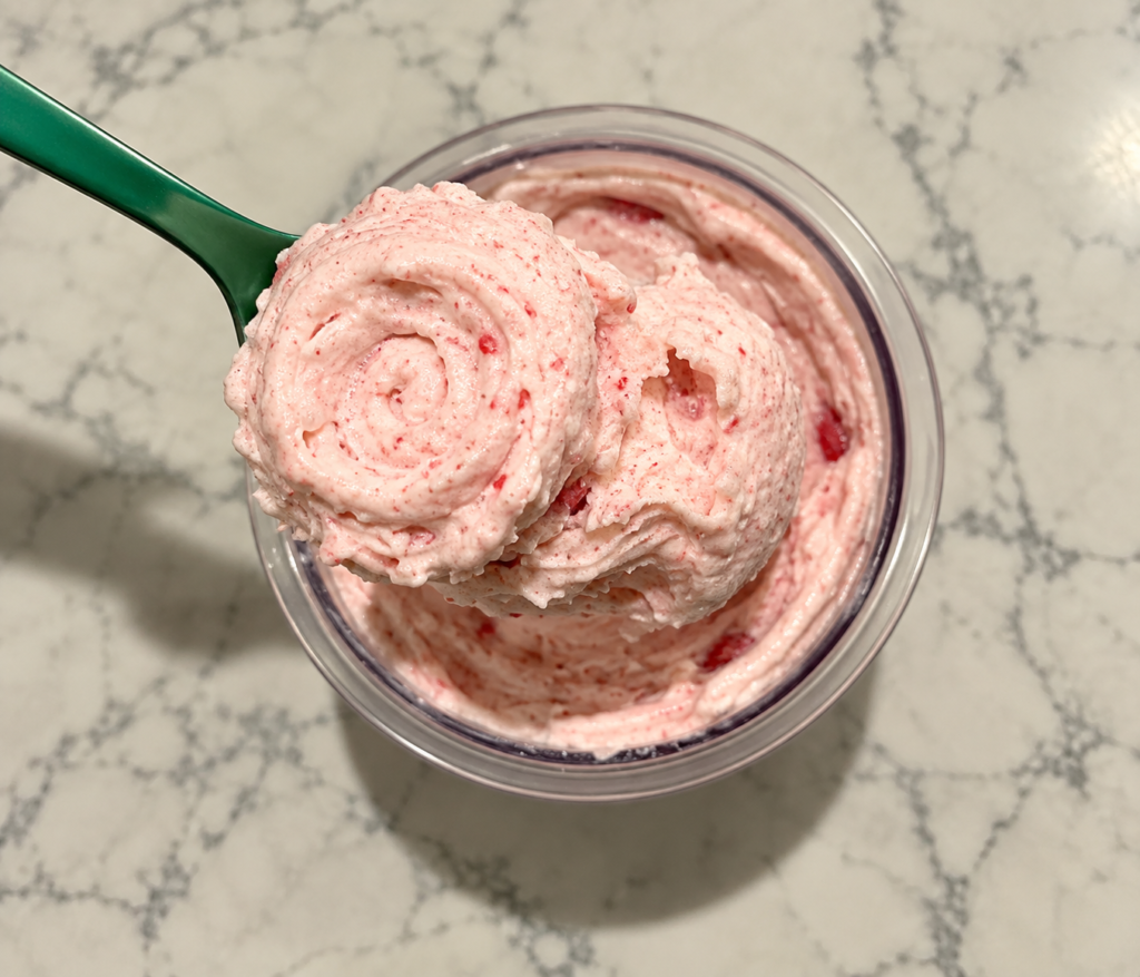 Strawberry Ninja Creami texture on a green spoon