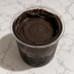 Dark Chocolate Ninja Creami made without protein powder in a clear pint container.