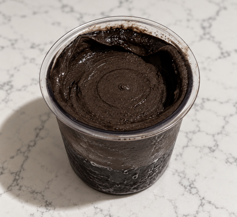 Dark Chocolate Ninja Creami made without protein powder in a clear pint container.