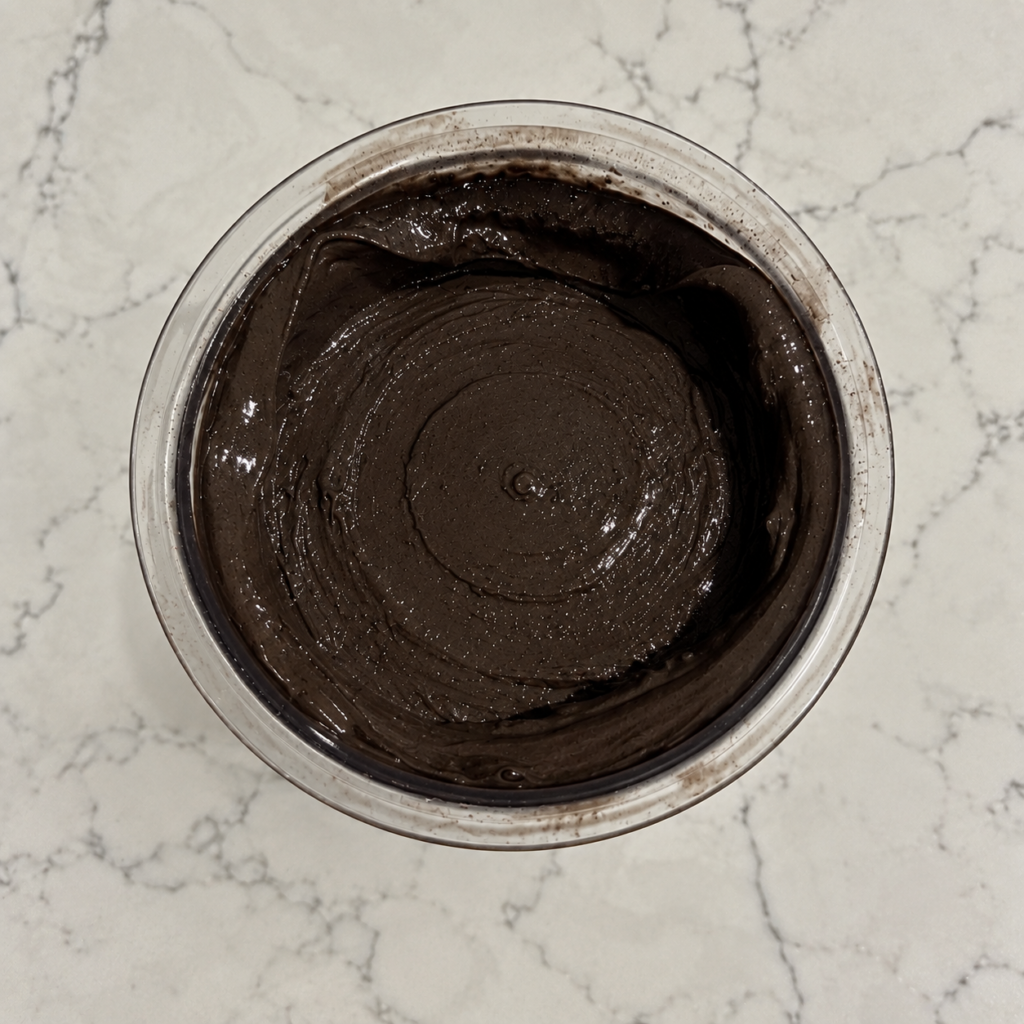 Overhead view of nearly black Dark Chocolate Ninja Creami showing its smooth, creamy texture.